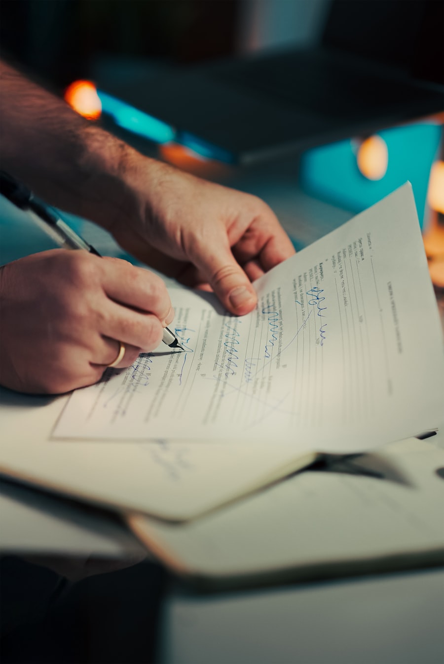 Carefully filling out and signing an admission application form
